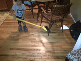 borrow daddy's slippers + interrupt mommy's cleaning to play broom hockey